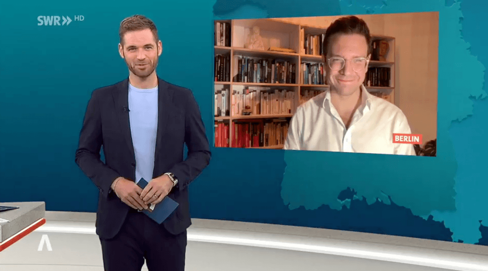 Juri Schnöller joining an SWR television interview from Berlin.
